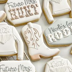 some cookies that are decorated like cowboy boots and boots with the words future mrs, future mrs