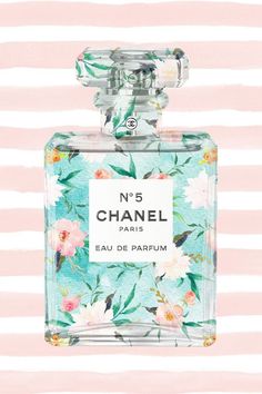 a bottle of chanel eau de parfum on a pink and white striped background