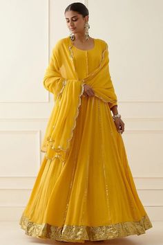 Yellow Embroidered Anarkali Set Featuring a yellow anarkali in Geprgette base with hand and machine embroidery. It is paired with a matching dupatta. This product will be shipped to you after 1-2 weeks from the date of order placed. All custom made orders are not returnable. {VARIATION MAY COME DEPENDING UPON AVALIBILITY OF LACES OR GOTTA PATI} NOTE: Visual Samples on website may differ slightly from actual product due to light & effects during photography (Length & Breadth have 1 n 1.5 inches +/-). Yellow Anarkali, Bridal Indian, Berry Dress, Bridal Makeup Images, Indian Bridal Photos, Embroidered Anarkali, Zari Embroidery, Utsav Fashion, Cocktail Wedding