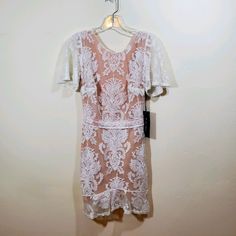 For Love And Lemons San Marcos Mini Lace Ivory Dress Size Small New With Tags Cream Lace Knee-length Dress, Cream Knee-length Mini Dress For Wedding, Feminine Cream Dress With Scalloped Lace, White Lace Midi Dress Feminine Style, White Lace Feminine Midi Dress, White Evening Lace Dress With Lace Trim, Cream Short Sleeve Mini Dress For Party, White Scalloped Lace Midi Dress For Formal Occasions, Elegant White Short-sleeved Mini Dress