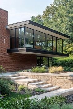 a modern house with steps leading up to it