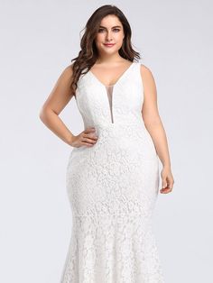 a woman wearing a plus size white dress with an open back and lace overlay