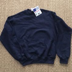 Brand New With Tags On Plain Navy Blue Sweatshirt. Basic Blue Tops With Ribbed Cuffs, Basic Blue Sweatshirt For Fall, Basic Blue School Tops, Basic Blue Tops For School, Blue T-shirt With Ribbed Cuffs For Streetwear, Blue Long Sleeve Sweatshirt For School, Blue Relaxed Fit Tops For School, Blue Crew Neck Sweatshirt For School, Casual Blue Sweatshirt For School