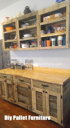 a kitchen island made out of pallet wood with open shelving units above it