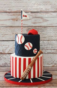 a baseball themed cake with a bat and ball on top