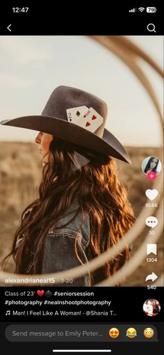 a woman with long hair wearing a cowboy hat