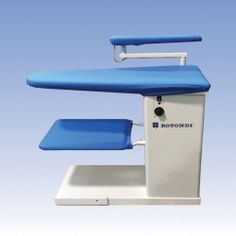 a blue and white medical chair with wheels on it's back end, against a blue sky background