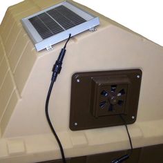 an electronic device is plugged into the side of a boat's roof ventilator