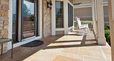 a porch with rocking chairs on it