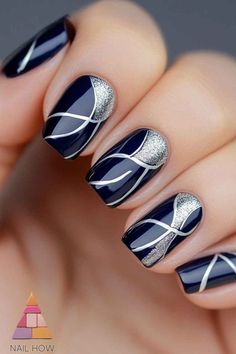 blue and silver nail polish with white lines on it, while the nails are shiny