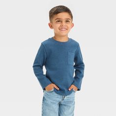 This Long-Sleeve Pocket T-Shirt from Cat & Jack™ makes a great cool-weather staple for your little one. Crafted from midweight jacquard-knit fabric and boasting a shrink-resistant construction, this long-sleeve T-shirt offers them all-day cozy comfort. Designed in a solid hue, this crewneck tee also features a chest patch pocket for classic style. Cat & Jack™: Designed for all children so you can trust it's made for yours. Blue Soft-washed Long Sleeve T-shirt, Winter Blue Soft-washed Tops, Boys Plaid, Long Sleeve Flannel, Toddler Boy Outfits, Long Sleeve Jersey, Boys Long Sleeve, Chambray Shirt, Light Blue Denim