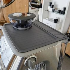 a silver blender sitting on top of a counter