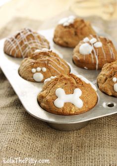 chocolate cookies with white frosting in a metal pan on a linen cloth covered tablecloth