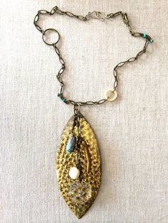 Ocean Necklace Bohemian Gold Necklace With Patina, Bohemian Metal Necklaces With Patina, Bohemian Brass Necklace With Patina, Bohemian Bronze Necklace With Vintage Charm, Bronze Bohemian Necklace With Vintage Charm, Bohemian Bronze Jewelry With Vintage Charm, Bronze Bohemian Jewelry With Vintage Charm, Rustic Beaded Gold Jewelry, Rustic Bronze Beaded Jewelry