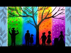 an image of people standing in front of a tree with the colors of the rainbow painted on it