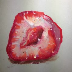 a piece of fruit that is red and pink