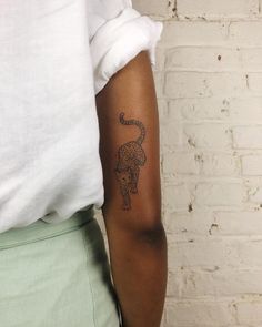 a person with a small tattoo on their arm