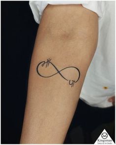 a person with a tattoo on their arm that has an infinite sign in the middle