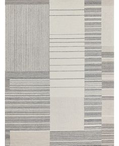 a gray and white rug with different stripes on the bottom, in various sizes and colors