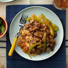 a white plate topped with meat and veggies