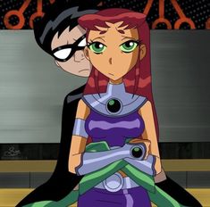 an animated image of a woman with red hair and green eyes standing next to a batman