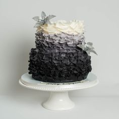 a black and white cake sitting on top of a plate