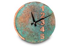 a clock that has numbers on it and is rusted green with brown trim around the face