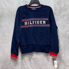 Tommy Hilfiger Blue Front Logo Crewneck Pullover Sweatshirt Sz M Ribbed Cuff And Hem Crewneck "Hilfiger" Logo On Chest Cotton, Polyester This Is A New With Tags Item. Please Refer To Images. Approx. Measurements: * Length: 22" * Sleeves: 24" * Chest: 22" Retail Price: $- Trendy Blue Tops With Ribbed Cuffs, Navy Crew Neck Sweatshirt For Spring, Tommy Hilfiger Letter Print Tops For Fall, Casual Blue Tommy Hilfiger Sweater, Tommy Hilfiger Navy Sporty Tops, Tommy Hilfiger Casual Tops With Ribbed Cuffs, Tommy Hilfiger Casual Top With Ribbed Cuffs, Casual Tommy Hilfiger Tops With Ribbed Cuffs, Tommy Hilfiger Blue Winter Tops