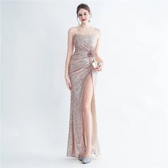 Alluring Design: Features a sexy strap design that adds a touch of elegance and sophistication. Shimmering Sequins: Adorned with sparkling sequins for a glamorous and eye-catching look. Maxi Length: A floor-length design that exudes grace and elegance, perfect for formal occasions. High-Quality Fabric: Crafted from premium materials to ensure both comfort and a refined appearance. Versatile Occasion Wear: Ideal for parties, proms, and evening events where making a statement is key. Custom Fit: A Prom Evening Dress With Beaded Straps For Party Season, Glamorous Sequin Dress With Beaded Straps For Night Out, Elegant Sequin Fabric For Evening And Prom Season, Formal Sequin Spaghetti Strap Dress For Party Season, Formal Sequin Dress With Spaghetti Straps For Party Season, Elegant Sequin Dress With Beaded Straps For Night Out, Formal Evening Dress With Beaded Spaghetti Straps, Sparkling Sequin Dress With Spaghetti Straps For Cocktail, Elegant Sequin Dress With Beaded Straps For Prom