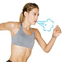 a woman is running while holding her arm out and looking at the clouds above her head