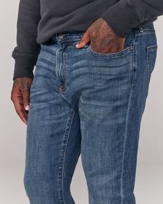 A classic silhouette that's straight from top to bottom with refined details and built-in stretch for superior comfort and flexibility. Classic Mid-rise Bottoms With Seam Detailing, Classic Straight Fit Medium Wash Bottoms, Classic Fitted Jeans With Straight Hem, Classic Medium Wash Straight Fit Bottoms, Classic Straight Fit Bottoms In Medium Wash, Classic Fitted Straight Hem Jeans, Classic Slim Medium Wash Bottoms, Classic Slim Bottoms For Everyday, Classic Slim Fit Jeans