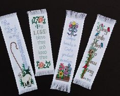 three cross - stitch bookmarks with words and pictures on them, one is for the lord