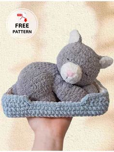 a hand holding a gray stuffed animal in a blue crochet basket with the caption free pattern