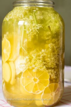 a mason jar filled with lemons and broccoli