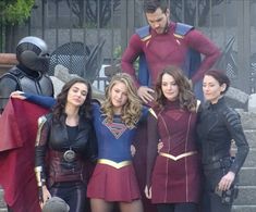 the flash and supergirls are posing for a photo