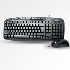 a computer keyboard and mouse sitting next to each other