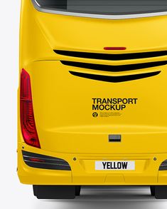 the back end of a yellow bus that is parked in front of a white background