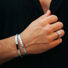 Inspired by the Great Kings of India, the Men’s Maharaja Open Bracelet is a stylish silver cuff with a twisted wire border and a row of silver discs – each one applied by hand. It’s the type of men’s narrow cuff bracelet that you can wear every day with business attire, weekend casuals and sportswear, and never tire of its eye-catching design and subtle silver shimmer.The Maharaja Solid-Silver Cuff Bangle is adjustable to fit all sizes, and it comes in a Charlotte’s Web gift box to delight the l Bracelets Set For Men, Luxury Sterling Silver Bracelet For Men As Gift, Bracelet For Men With Stone, Luxury Masculine Bracelets For Formal Occasions, Luxury Masculine Jewelry For Formal Occasions, Handmade Silver Bracelets For Men, Affordable Silver Leather Bracelet For Men, Luxury Leather Bracelet For Men, Luxury Engraved Sterling Silver Bracelet For Men