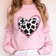 Our Cow Print Heart Valentine's sweatshirt is a great gift for the cow print lover in your life.   The comfortable fit and cool design of this cute cow print sweatshirt means that it feels just as good to wear as it is to look at. If you've been looking for a fun heart Valentine's sweatshirt for yourself, or your favorite friend, you should get this cute sweatshirt today. Ideal for any situation, a unisex heavy blend crewneck sweatshirt is pure comfort. These garments are made from polyester and cotton. This combination helps designs come out looking fresh and beautiful. The collar is ribbed knit, so it retains its shape even after washing. There are no itchy side seams on these sweatshirts. .: 50% Cotton 50% Polyester .: Medium-heavy fabric .: Loose fit .: Sewn in label .: Runs true to si Casual Cow Print Crew Neck Top, Casual Crew Neck Cow Print Tops, Cotton Crew Neck Top With Cow Print, Casual Long Sleeve Tops With Cow Print, Casual Long Sleeve Cow Print Top, Cow Print Valentines, Cow Print Shirts, Cow Print Sweatshirt, Cow Print Heart