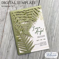 an image of a wedding card with fern leaves on the front and green foliage on the back