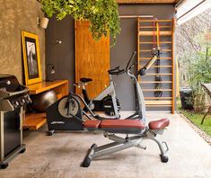 a home gym with exercise equipment in it