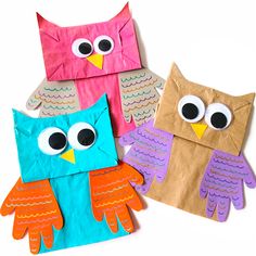 three paper owls sitting on top of each other