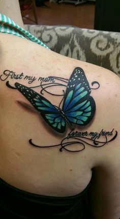 a woman with a blue butterfly tattoo on her shoulder and the words trust my mom