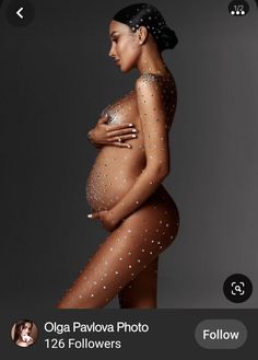 an image of a pregnant woman with glitters on her body and the caption's name below it