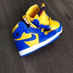 Brand New No Original Box Size 2c Or 4c Toddler Baby (Please Choose Correct Size) Brand Nike Air Jordan Model Air Jordan 1 Reverse Laney Style # Fd2598-700 Colorway Blue Yellow / White Soles Yellow High-top Synthetic Jordan Shoes, Yellow High-top Jordan Shoes, Yellow Synthetic Jordan Sport Shoes, Yellow Synthetic Jordan Sporty Shoes, Yellow Synthetic Jordan Shoes, Yellow Sporty Jordan Shoes In Synthetic Material, Yellow Sporty Jordan Shoes, Yellow Synthetic Basketball Shoes With Round Toe, Sporty High-top Jordan Shoes For Playtime