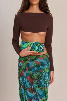 An ornate beaded midi skirt in an abstract floral pattern with a mesh underlayer and a center back zipper. — Midi length — Column silhouette — Beaded with a mesh base — Center back zipper — Wear with the Maison Top Evening Flats, Tulip Print, Sandal Platform, Swimming Bag, Boot Accessories, White Summer, Kids Boots, Fall Collections, Abstract Floral