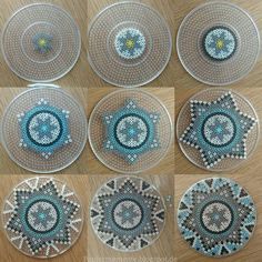 six glass plates with beaded designs on them sitting on a wooden table next to each other