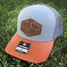 Golf Patch Hat - Over Par and Under the Influence The perfect hat for golfers! Details: *Adjustable Snapback One Size Fits Most *Available in;  Gray/Burnt Orange, Camo/Black, Moss/Khaki, Gray/Black, Gray/White * Patches adhered with industrial hat press (not sewen on) *Hats are handwash only Feel free to contact us with any questions. Turnaround time is typically 1.5-2 weeks. Please contact us first if you have a date sooner than this turnaround time. Hats are made to order, we are unable to accept returns or exchanges unless defective. We strive to produce top-quality items. If you have an issue with an order please contact us and we will do our best to assist you.  All orders are shipped via USPS.  Due to monitor variations, colors may vary slightly. Props in photos are not included. Loc Adjustable Six-panel Snapback Hat For Golf, Adjustable Six-panel Trucker Hat For Golf, Golf Hats Mens, Outdoors Style, Richardson Hats, Hat Bar, Cape Girardeau, Laser Ideas, Orange Camo