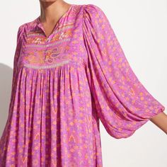 This Boho Dress Flatters The Body Whilst Creating Drama Through The Billowing Gathered Sleeves And Voluminous Skirt. Signature Madame Peacock Print In A Stunning Boysenberry Colorway Is So Rich It Can Almost Be Tasted, Featuring Hand-Drawn Paisleys, Variegated Florals And Geometric Shapes For A Reimagined Take On Heritage Indian Textiles. An Effortless Throw-On Piece, Crafted From Lenzing Ecovero Viscose And Fully Lined, This Style Evokes A Sense Of Otherworldly Glam And Can Be Worn Through All Seasons. Size S Approx Measurements: Bust 36.5"; Hem 145.5"; Length 46"; Sleeve Length 24.5"; Sleeve Hem (Relaxed) 7.75"; Sleeve Hem (Stretched) 15" 100% Lenzing Ecovero Viscose Cool Bohemian Tunic Dress In Viscose, Daywear Rayon Tunic Dress, Pink Rayon Dress For Daywear, Bohemian Viscose Dresses With Floral Print, Boho Print Loose Fit Viscose Dress, Flowy Boho Print Viscose Dress, Bohemian Viscose Floral Print Dresses, Summer Silk Dresses With Boho Print, Purple Floral Print Tunic Dress