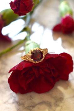 Metal: 14kt Yellow Gold Stone: Garnet Shape: Round Garnet Weight: 1.65 ctw Ring Size: 5 1/2 Sizing: Please state ring size in the personalization box. Weight of entire piece with stones: 3.50grams Width Of Top Part Of Ring : 10mm Customization: We can custom make this ring with any gems and metals. Please inquire if interested. White Gold Amethyst Version: https://www.etsy.com/listing/231479258/sale-vintage-style-14k-white-gold?ref=shop_home_active_7&frs=1 Rose Gold Aquamarine Version: https Gold Garnet Ring, 1 Rose, Garnet Ring, Gold Stone, Gold Filigree, Garnet Rings, Statement Rings, Garnet, Heart Ring